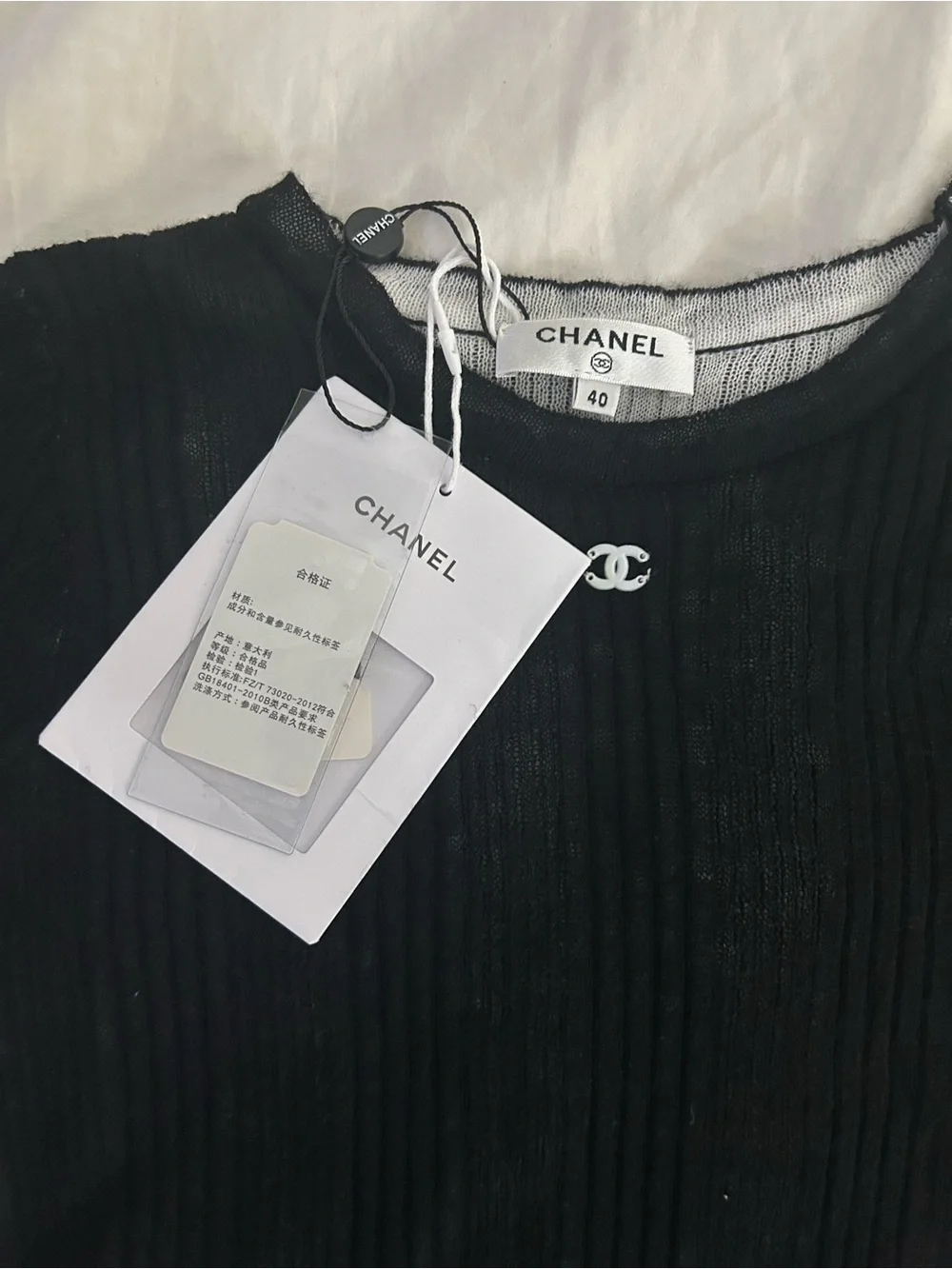 New CHANEL Black Ribbed Short Sleeve Knit Tee with Logo Charm